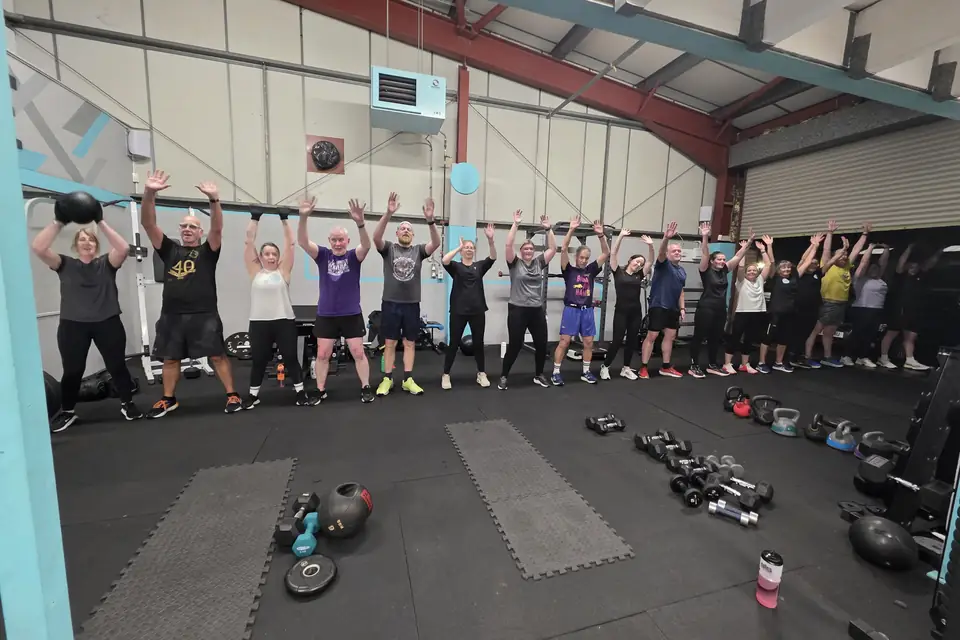 Lucy and clients training under the LET LUCE wall at Unit 49.