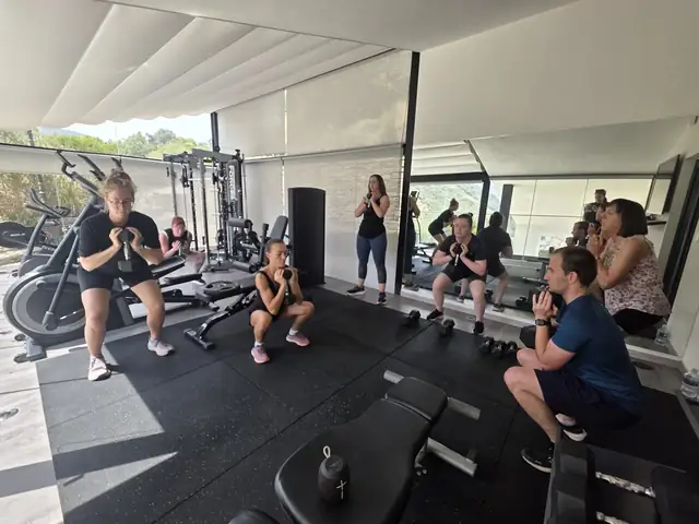 A Let Luce group training with kettlebells in a villa gym in the Douro Valley.